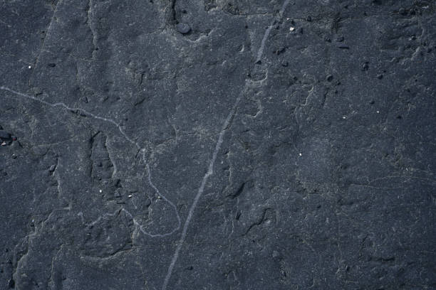 istock Stunning dark grey rough rock surface texture, directly above 2170587062