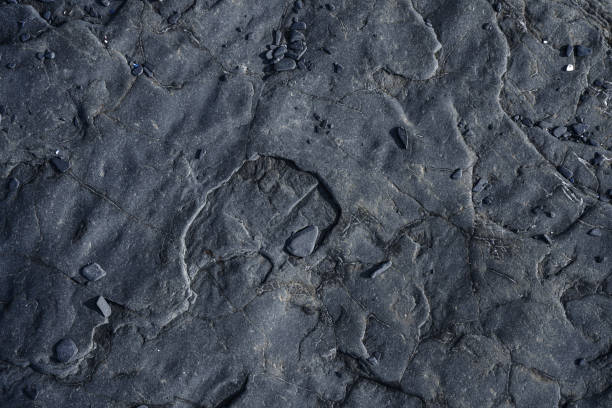 istock Stunning dark grey rough rock surface texture, directly above 2170587115