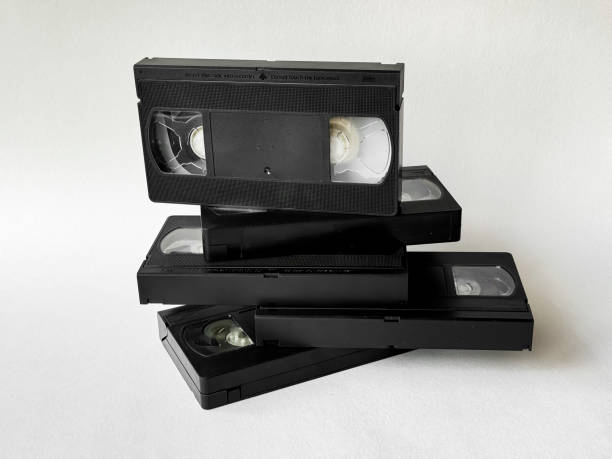 istock Retro vhs tapes stack on white background: nostalgia and vintage media trend 2170587404