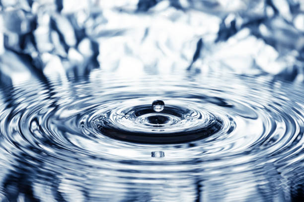 Water Drop Ripple over a colorful Water Surface. Vivid colors are naturally reflected and not digitally generated.
