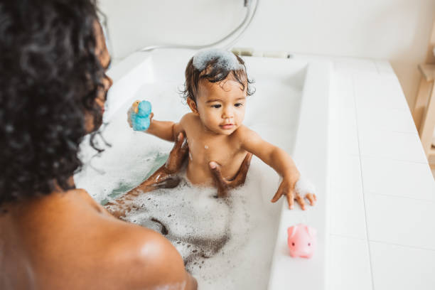 istock Mother and baby bathing 2170589588