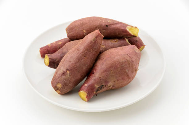 Steamed sweet potatoes on a white plate