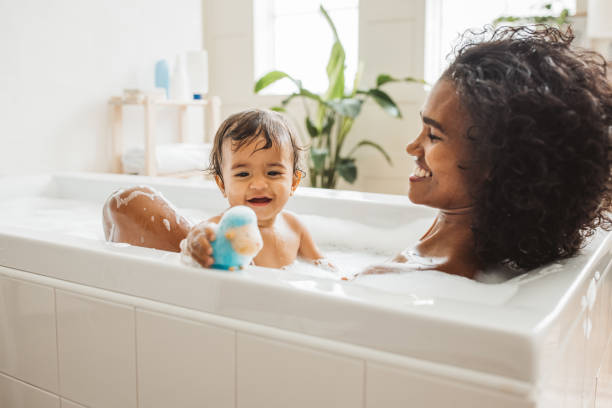 istock Mother and baby bathing 2170590487