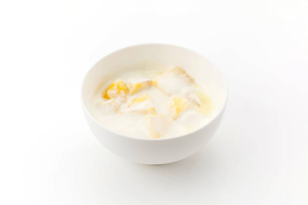 Fruits with whipped cream on a black background isolated