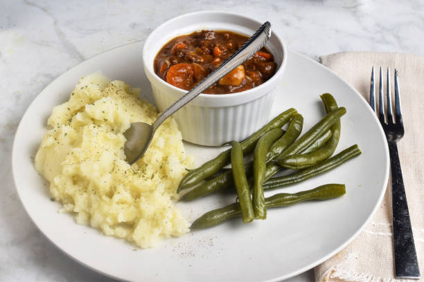 istock beef stew served  with mash potatoes and green beans 2170590588