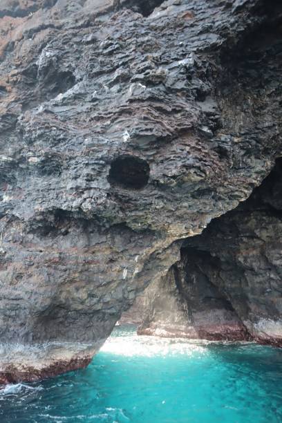 istock Sunlight filtering through sea cave in Kauai, Hawaii sea cave formation 2170590886