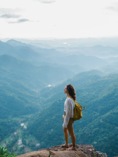 istock Woman on viewpoint in Ella overlooking little Adam's peak 2170591346