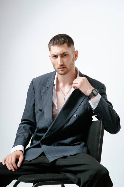 istock Handsome man, fashion model sits on chair 2170592261