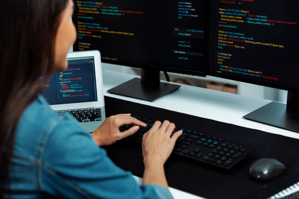 istock Young Asian in IT creating with typing online information on pc. Stratagem. 2170592516