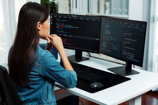 istock Young Asian in IT developer looking online information on pc to pose. Stratagem. 2170592915