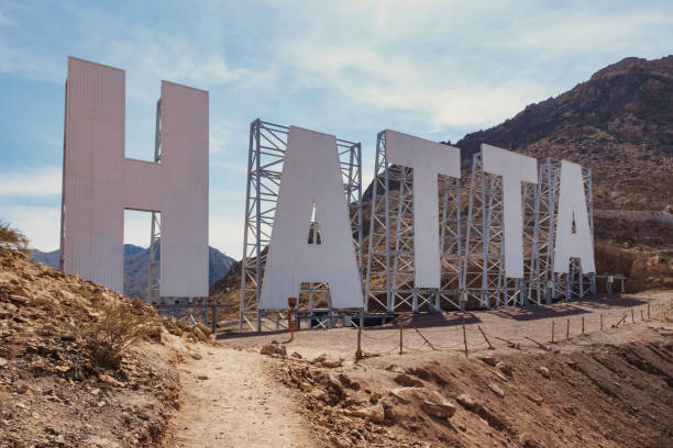 Hatta Sign in the Hajar Mountains, Hatta, United Arab Emirates on a sunny day.