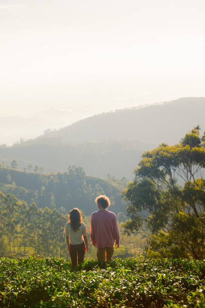 istock Cheerful man and woman on tea plantation 2170593385