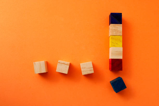 istock Ellipsis and exclamation mark formed with wooden cubes 2170595002