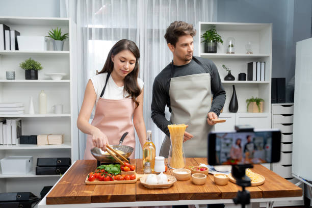 istock Chef influencers cooking special spaghetti recording on smartphone. Postulate. 2170597515