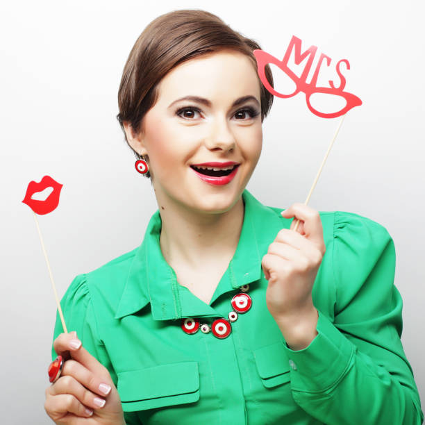 istock playful young woman ready for party 2170597550
