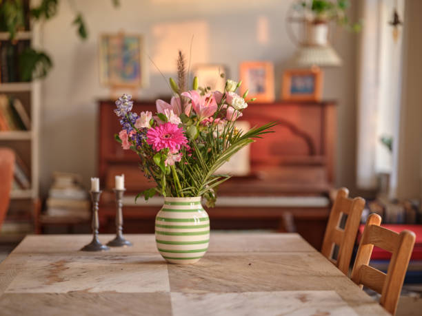 A bouquet of flowers on a dinning table in the livingroom
