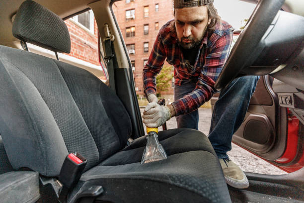 istock Cleaning service worker vacuuming driver car seat in the car. 2170601877