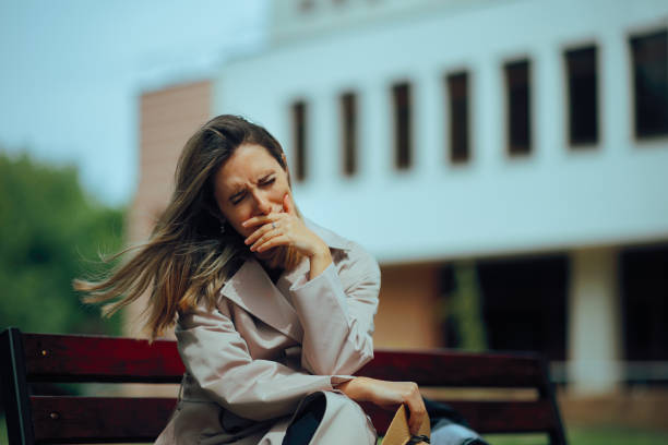 istock Unhappy Woman Crying Alone on a Bench in the Park 2170605094