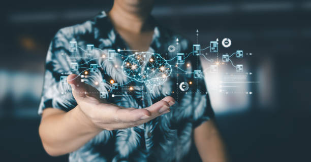 Businessman is showing concept of future technology and internet connection network with AI as controller. A graphic floated in the air on his hand. Data center network concept.