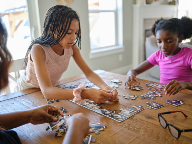 istock Family in a Home Working on a Jigsaw Puzzle 2170609150