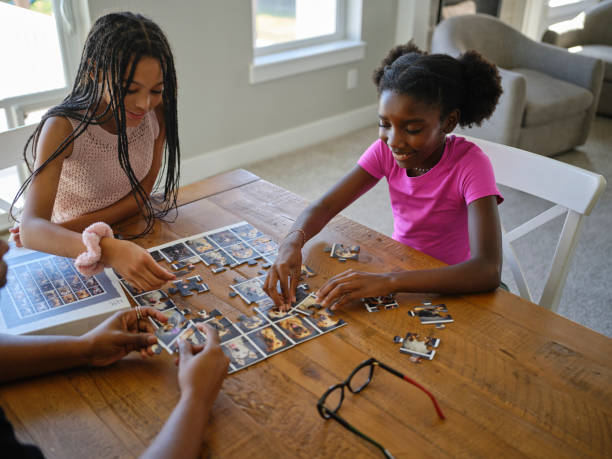 istock Family in a Home Working on a Jigsaw Puzzle 2170609188