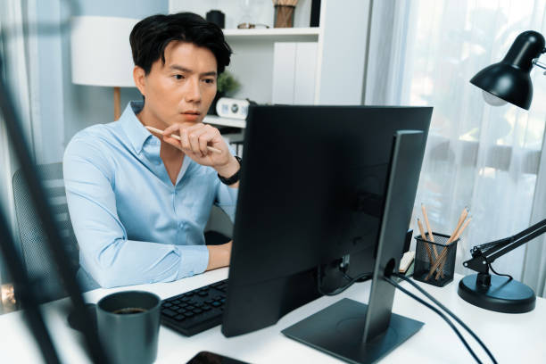 istock Serious smart businessman working computer to check email at office. Infobahn. 2170610221
