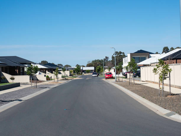 istock Wide street in new housing development 2170611314