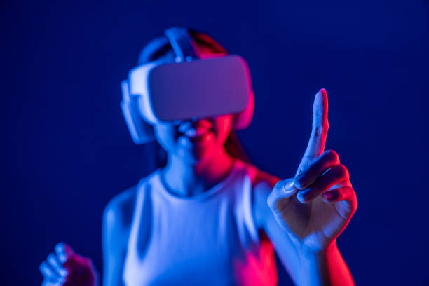 istock Elegant female connect metaverse use finger point virtual object. Hallucination. 2170614758