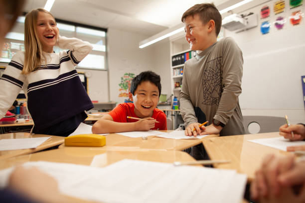 The teacher demands silence while the students do the test in the school