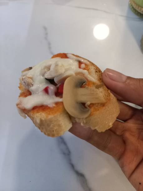 istock mini pizza with mushroom and meat topping 2170618951