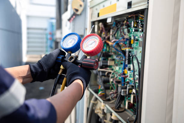 istock Air conditioning, HVAC service technician using gauges to check refrigerant and add refrigerant,Air Conditioning Repair, repairman on the floor fixing air conditioning system. 2170619366