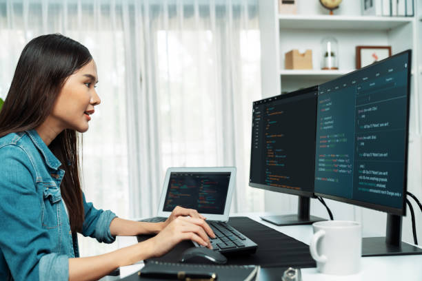 istock Young Asian in IT creating with typing online information on pc. Stratagem. 2170620802