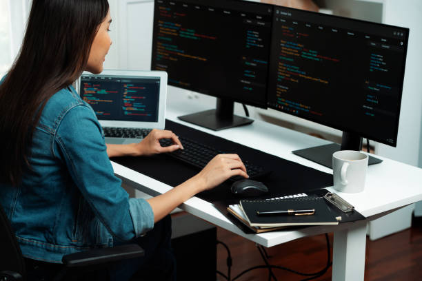 istock Young Asian in IT creating with typing online information on pc. Stratagem. 2170623939