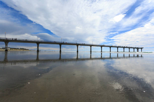 istock Tranquil Pier Over Reflected Sky at New Brighton Beach 2170626223
