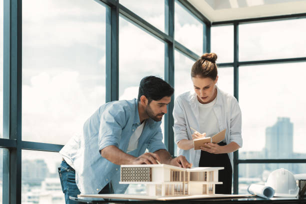 istock Smart architect engineer team working together to measure house model. Tracery. 2170628866