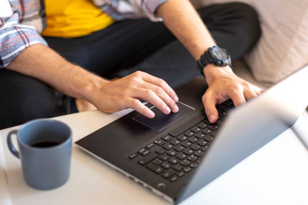 istock Close-up of unknown man's hands working on laptop in his office 2170629827
