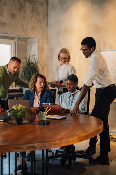 istock Multiracial coworkers have fun working together at office brainstorming 2170631578