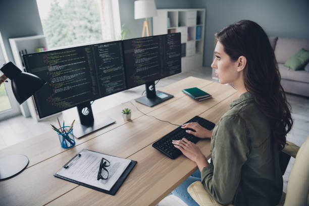 istock Photo of intelligent serious lady hacker signed document security requirements nondisclosure information system indoor home workstation 2170631592