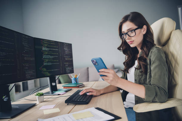 istock Photo of concentrated confident lady professional web designer search site interface write notes content plan indoor room workstation 2170631605