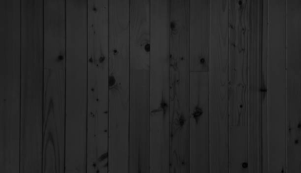 istock dark black indoor minimal oak wood panel showing beautiful wood grain. 2170632393