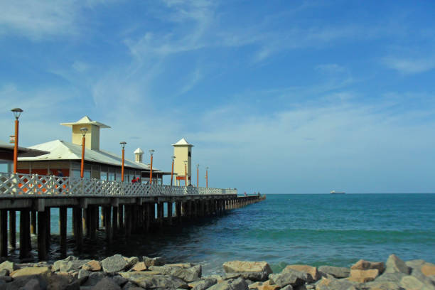 istock Pier and ship on the horizon 2170642120
