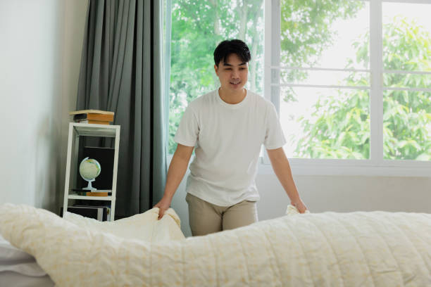 istock Asian man man doing Household Chores. Making bed. 2170642510