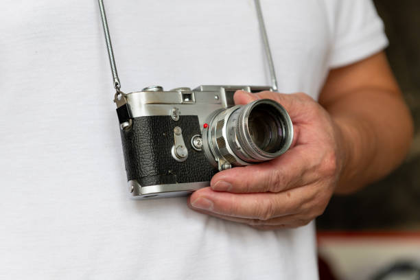 istock A person carrying a classic film camera. 2170642726