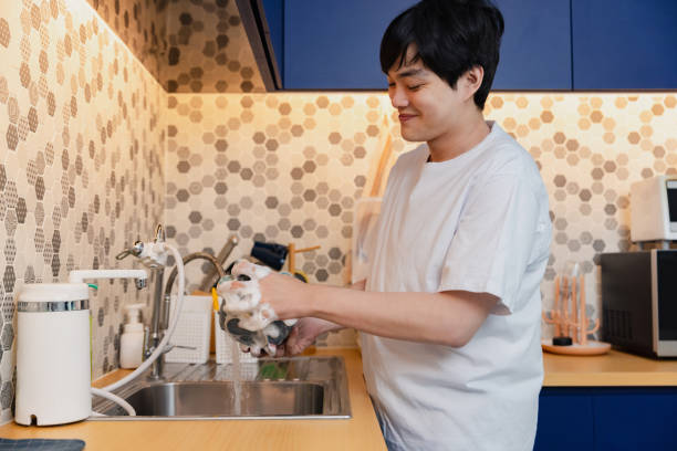 istock Asian man man doing Household Chores. Washing dished. 2170642766