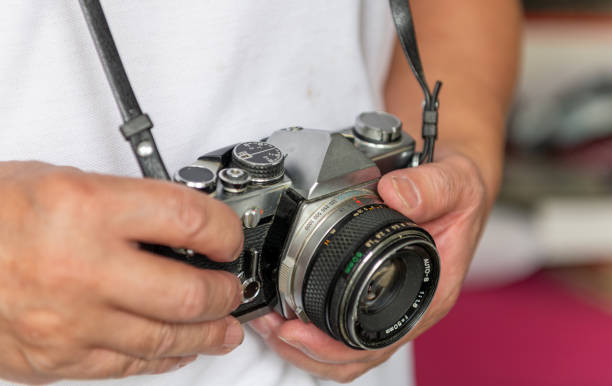 istock A person carrying a vintage camera. 2170643832