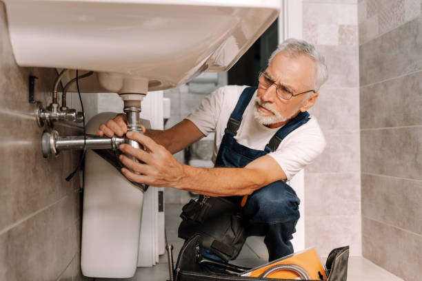 istock Senior plumber fixing sink pipe in bathroom 2170643845