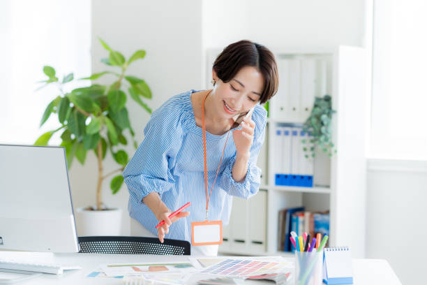 istock Business woman with smartphone in office 2170646731
