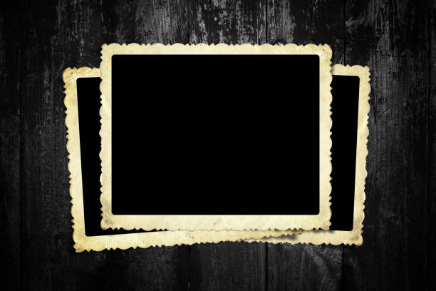 Old blank instant photo frame on wood background. Picture frame.