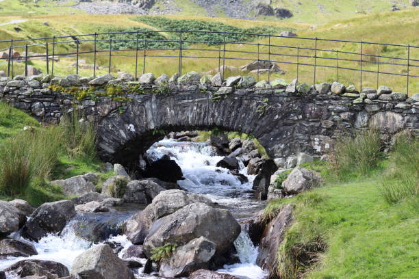Traditional stone bridge over a stream in the Lake District