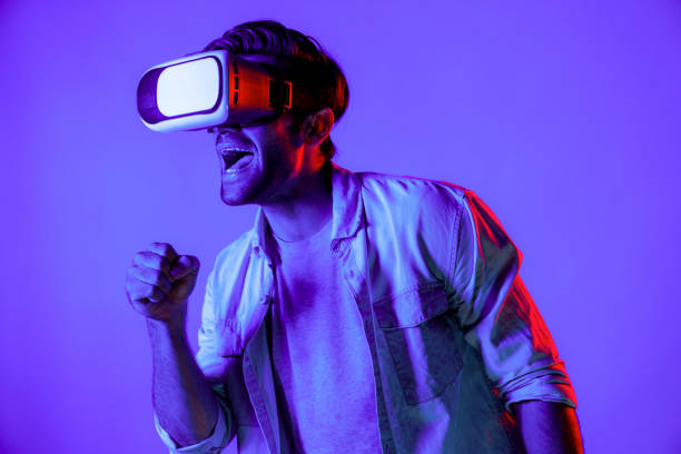 istock Caucasian man singing a song in virtual world at neon background. Deviation. 2170657657